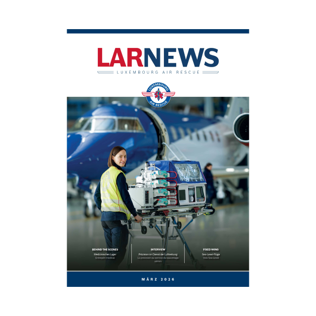 Cover of LAR NEWS Luxembourg Air Rescue March 2026 issue, showing a woman in a yellow safety vest pushing medical equipment on a stretcher in front of a blue aircraft.
