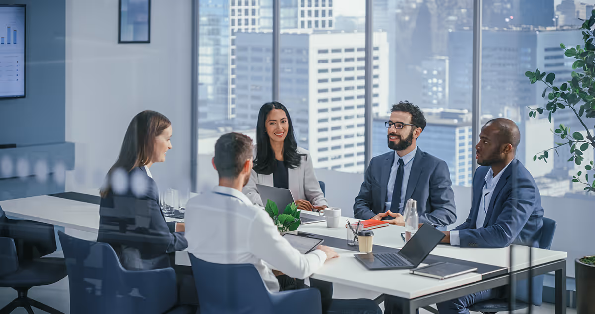 Business meeting in a modern office — representing insurance solutions for online travel agents