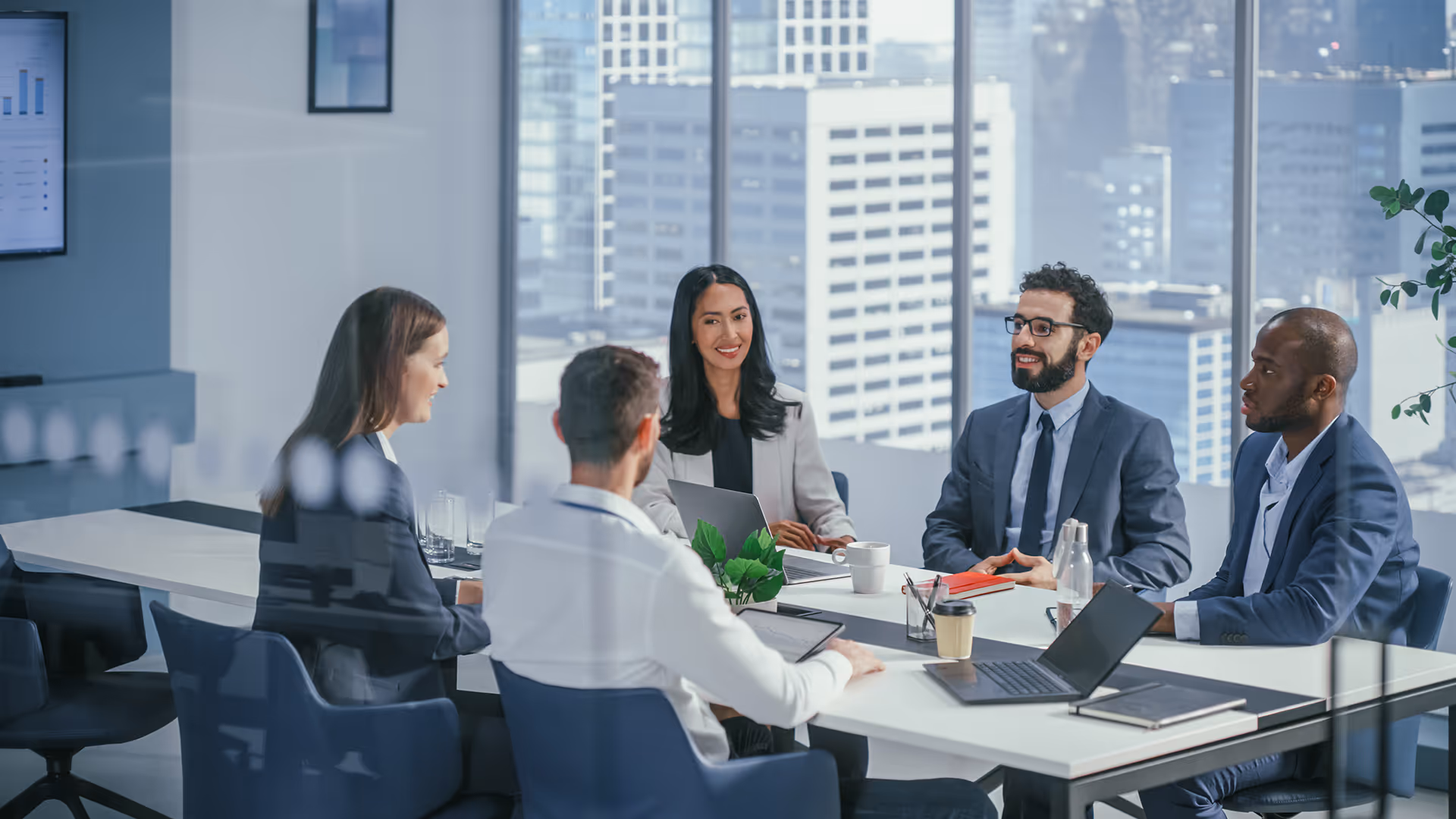 Business meeting in a modern office — representing insurance solutions for online travel agents