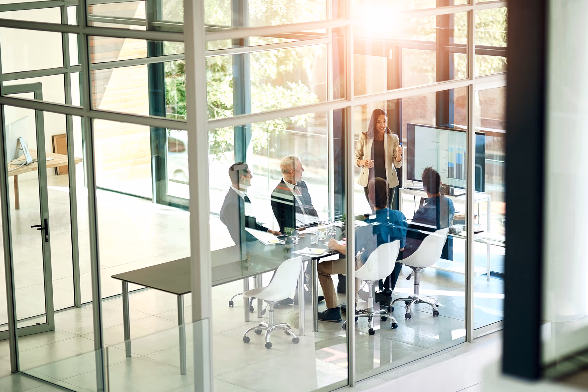 A group of people discussing finances in a meeting — representing scheduled airline failure insurance
