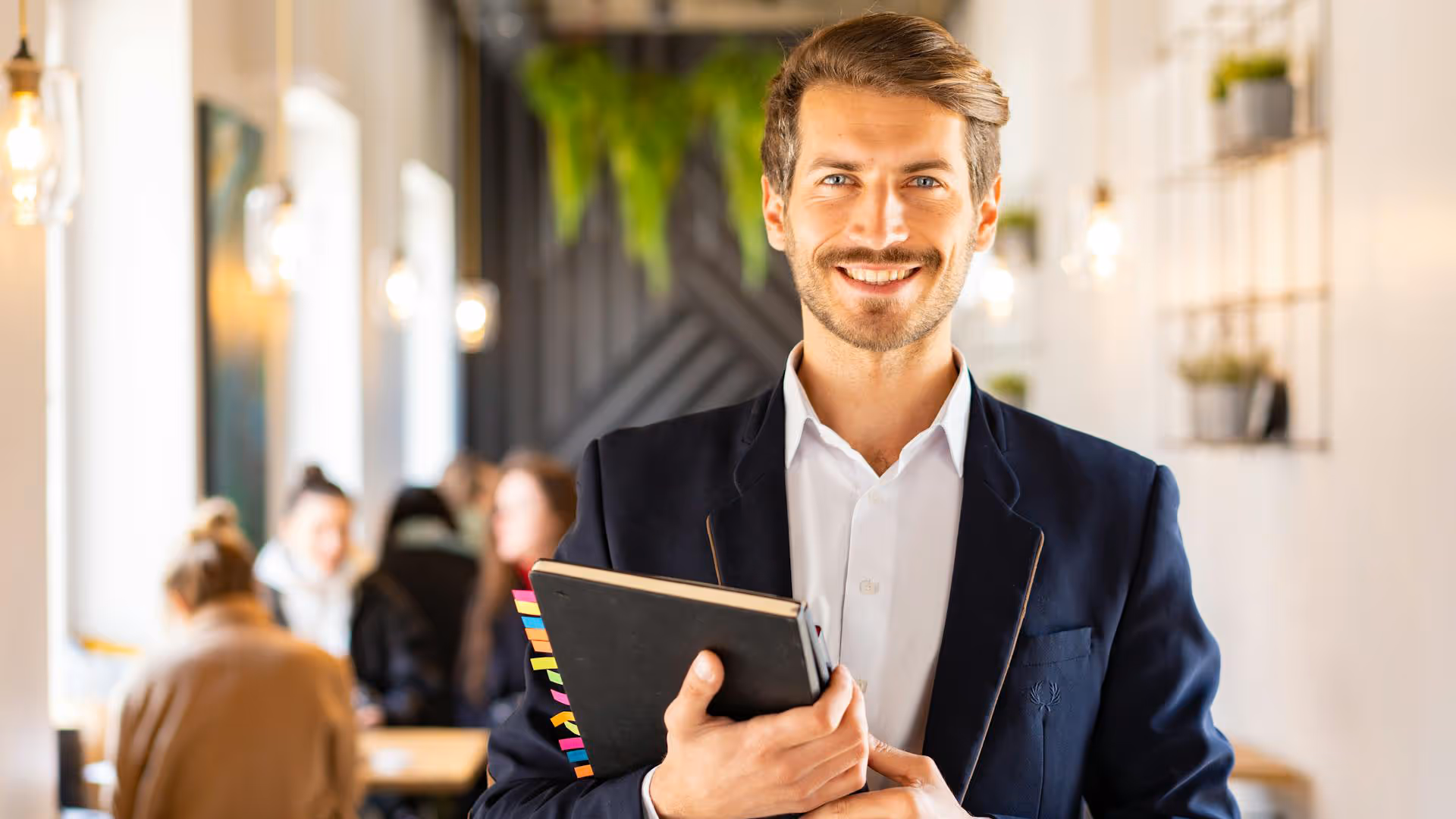 Man smiling with document binder