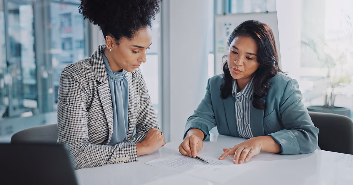 Women discussing what is covered by supplier failure insurance