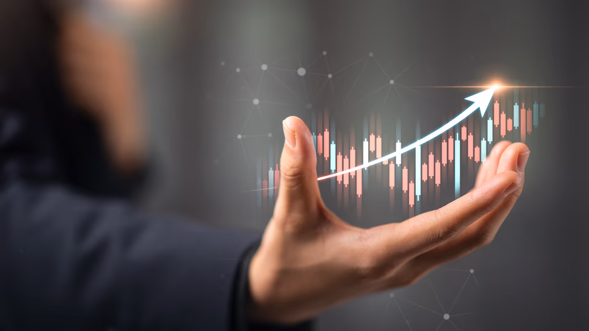 Hand with an upwards turning graph overlaid