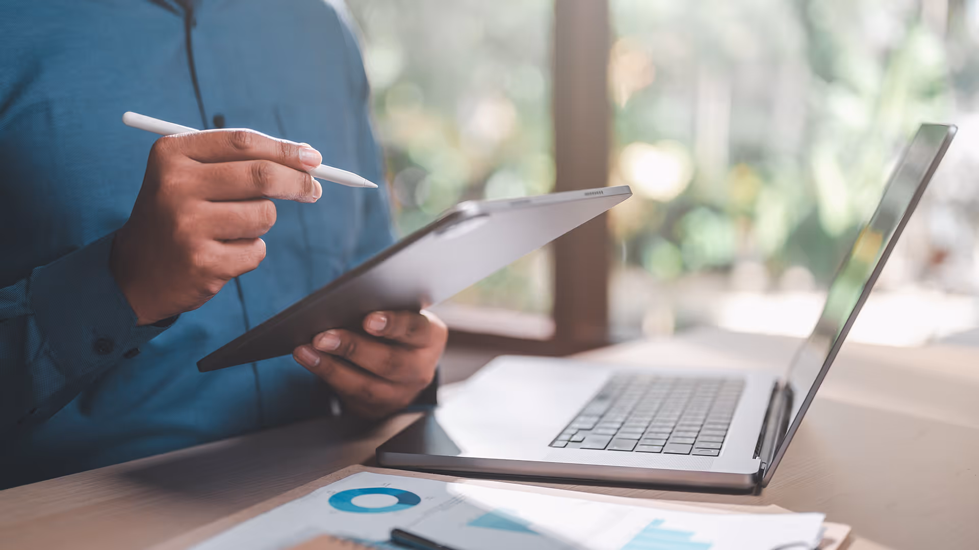 Person making notes on a tablet device