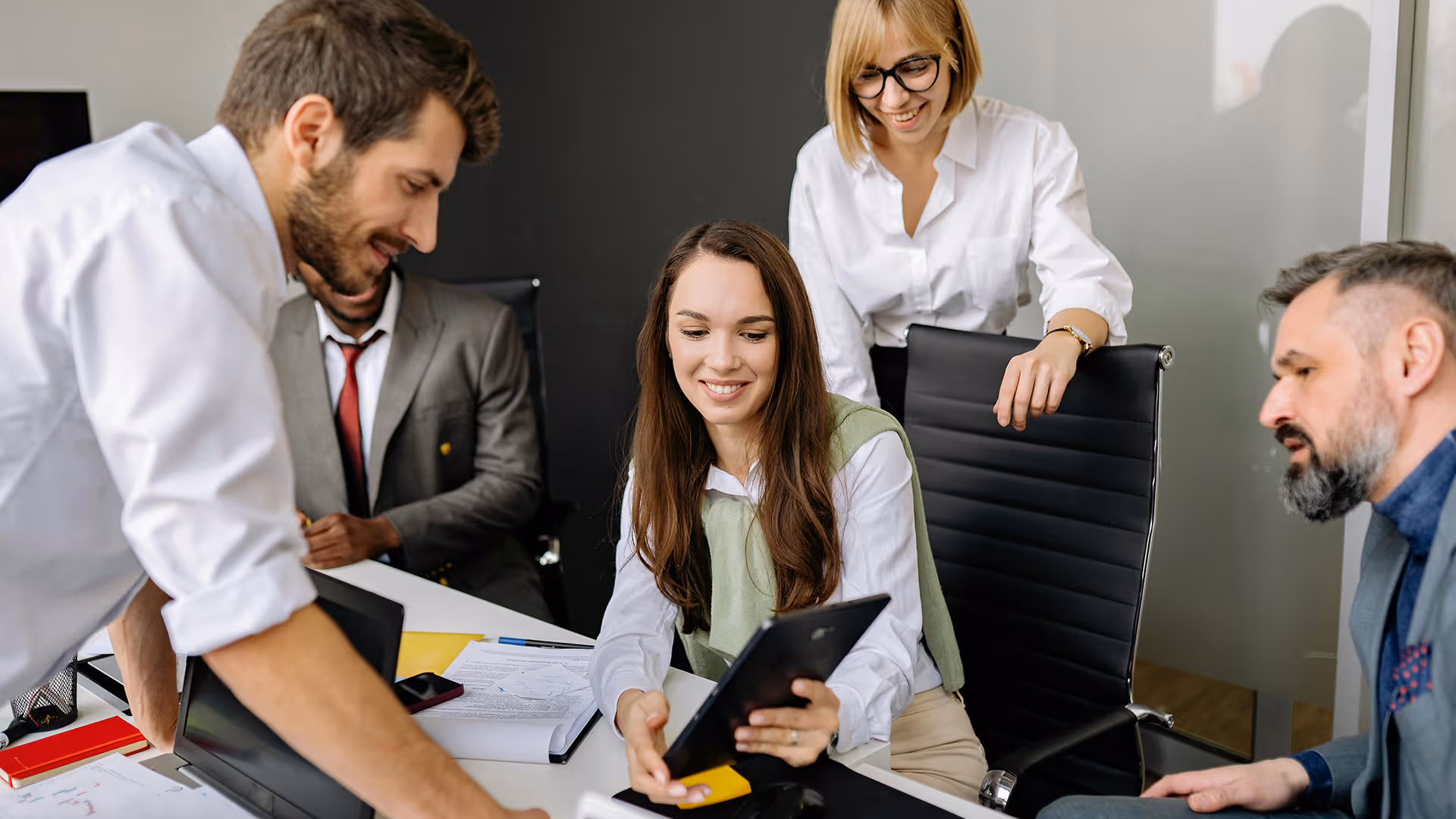 Showing tailored insurance options on a tablet during a meeting