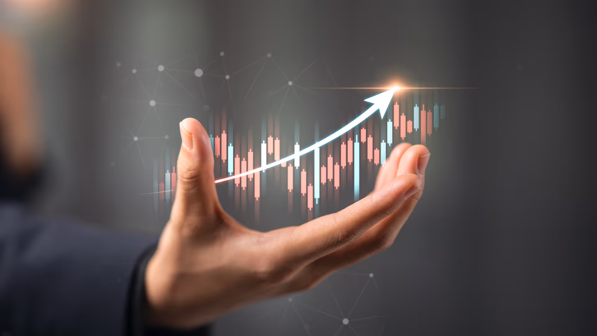 Hand with an upwards turning graph overlaid