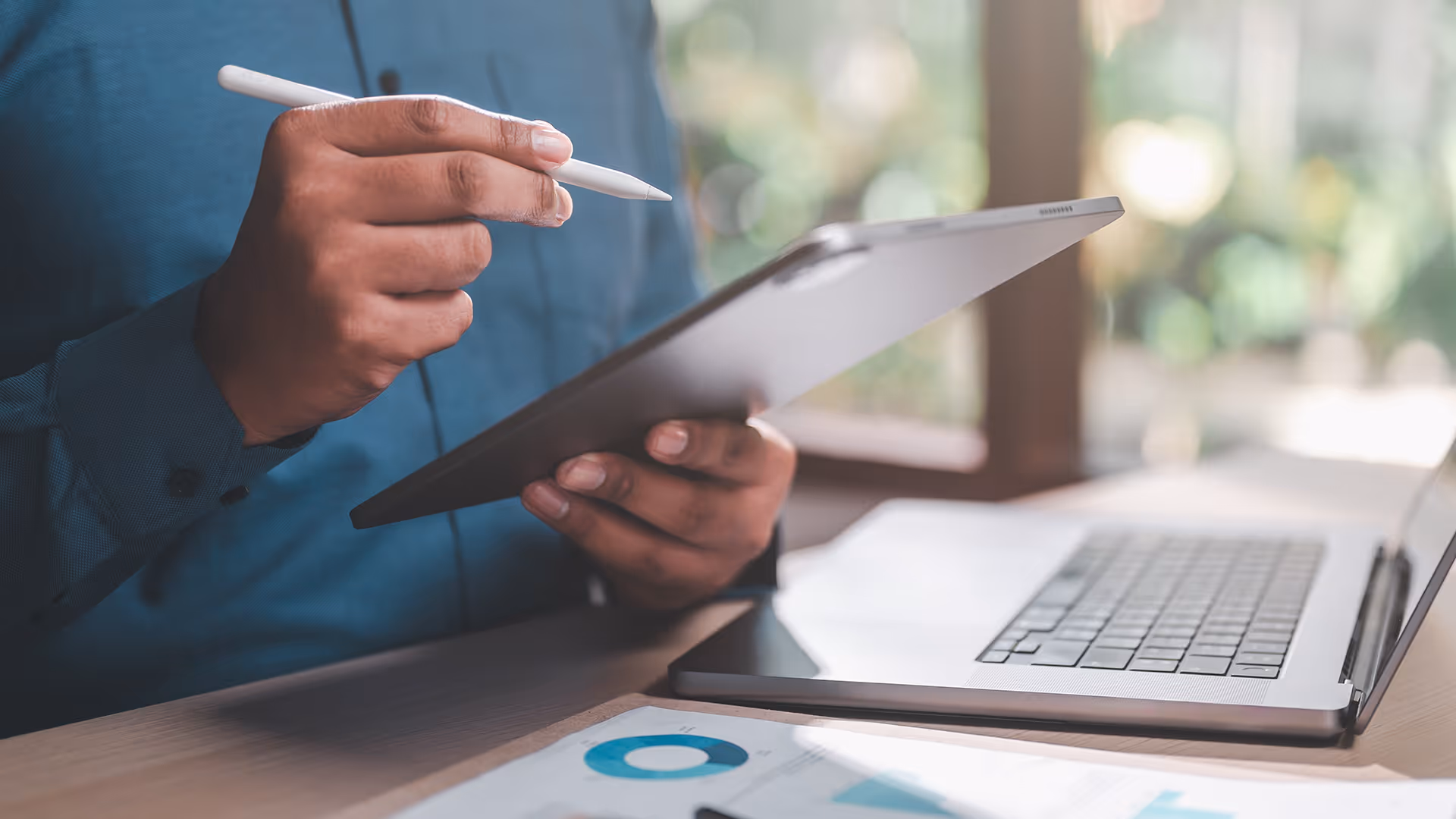 Person making notes on a tablet device