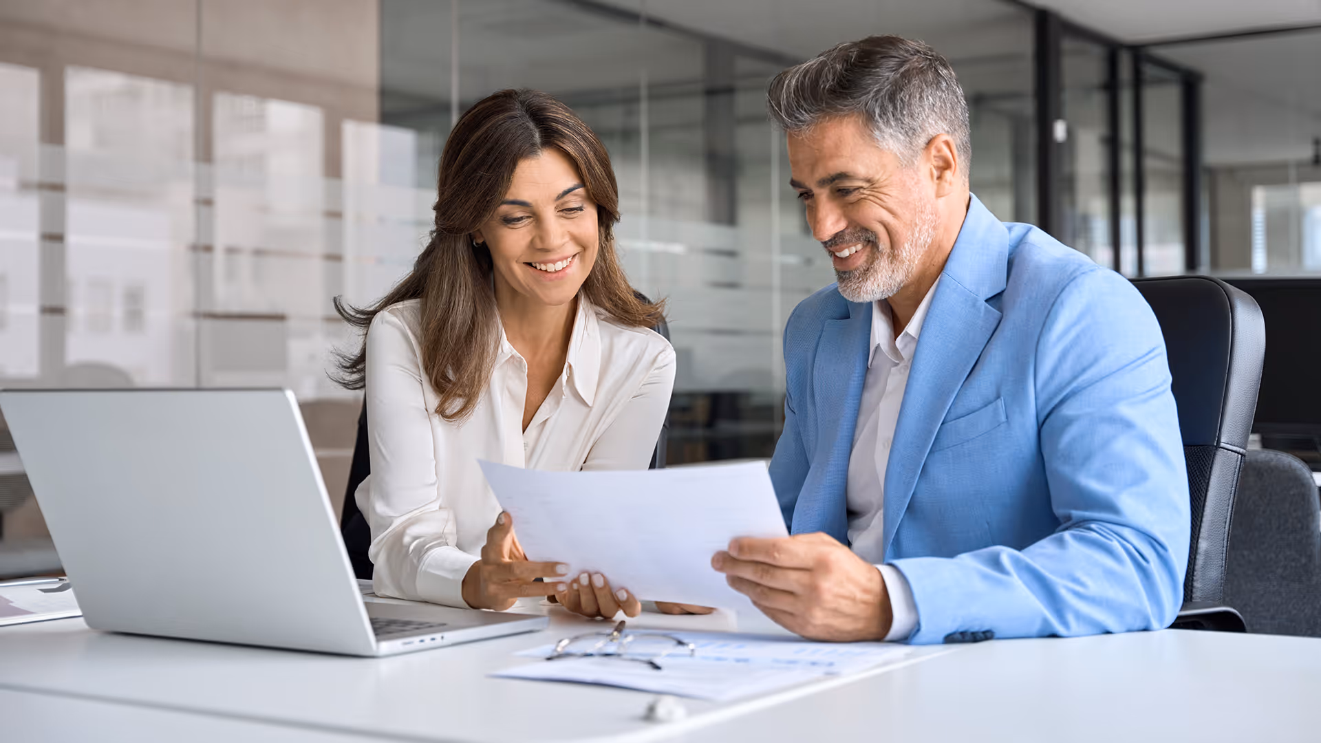 Business people reviewing travel insurance solutions