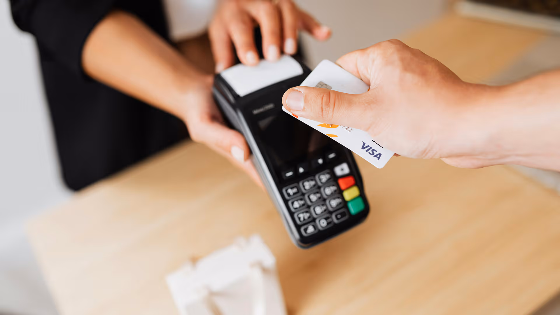 Man making an over the counter card payment