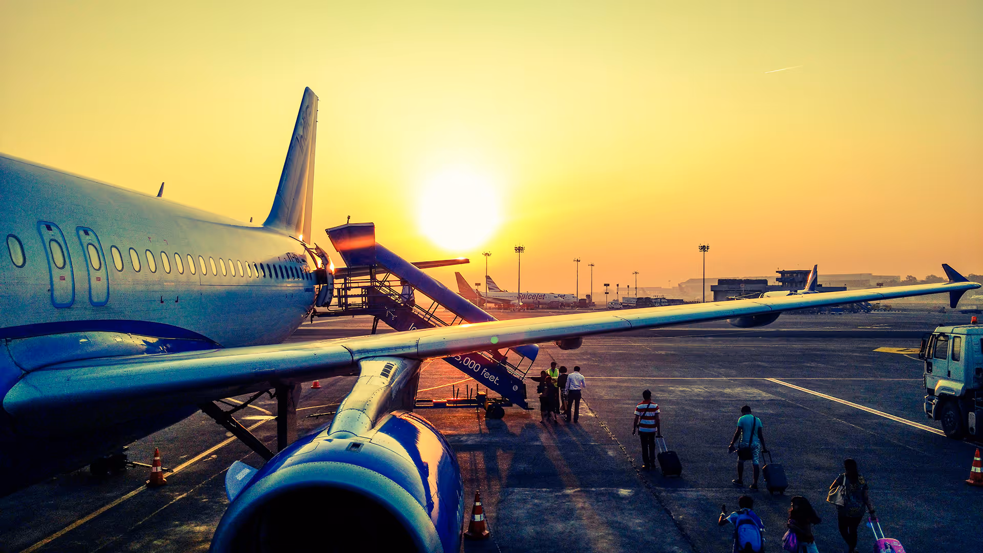 People boarding a plane at an airport