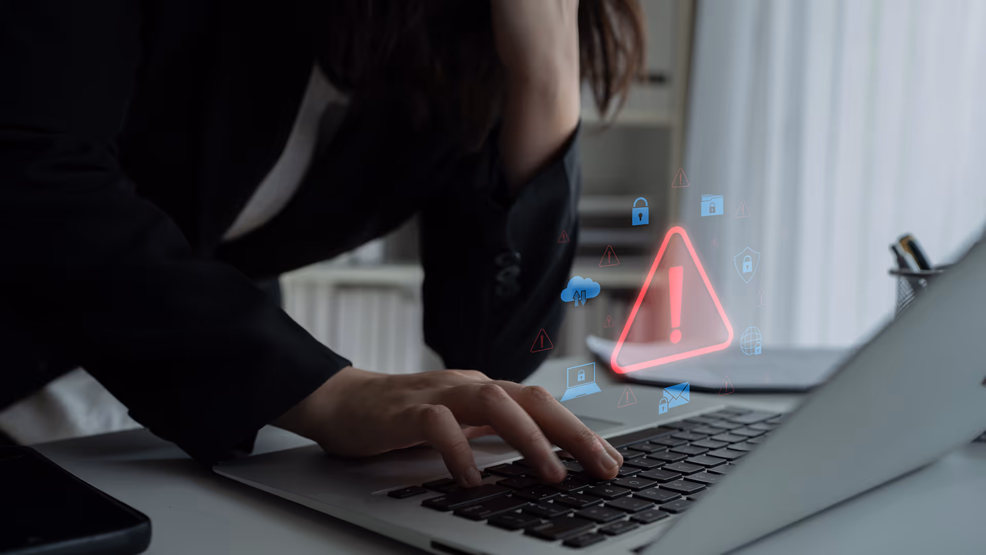 Red exclamation mark above a laptop, representing travel fraud