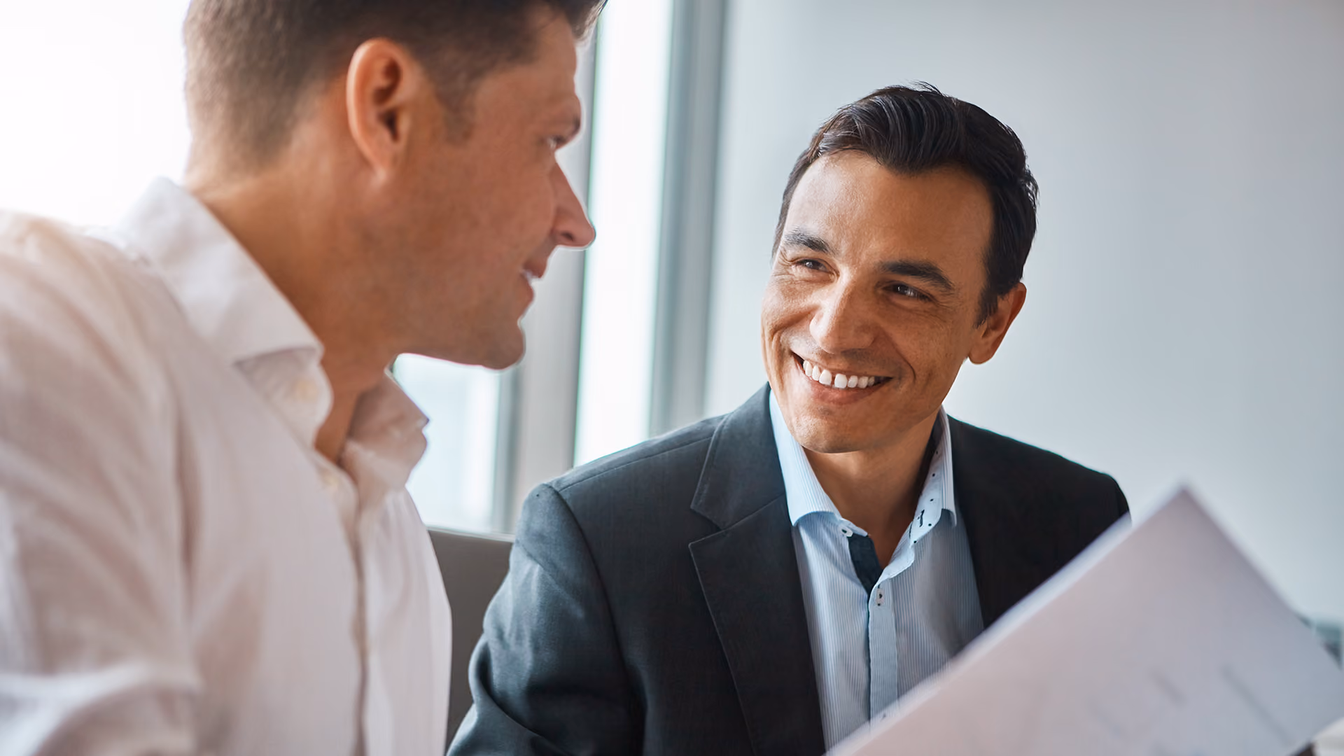 Businessmen discussing package travel regulation solutions