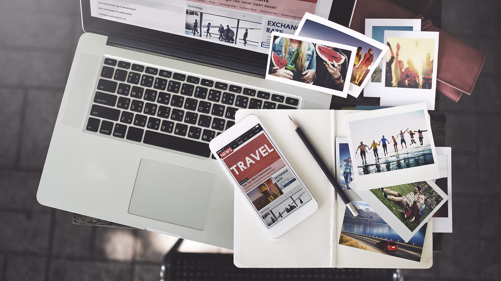 Travel news on phone and laptop with photos