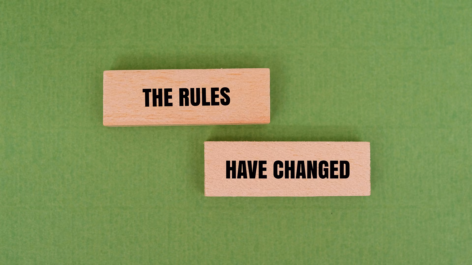 Wooden blocks with the rules have changed written on them, representing the the package travel regulations amendments for 2026