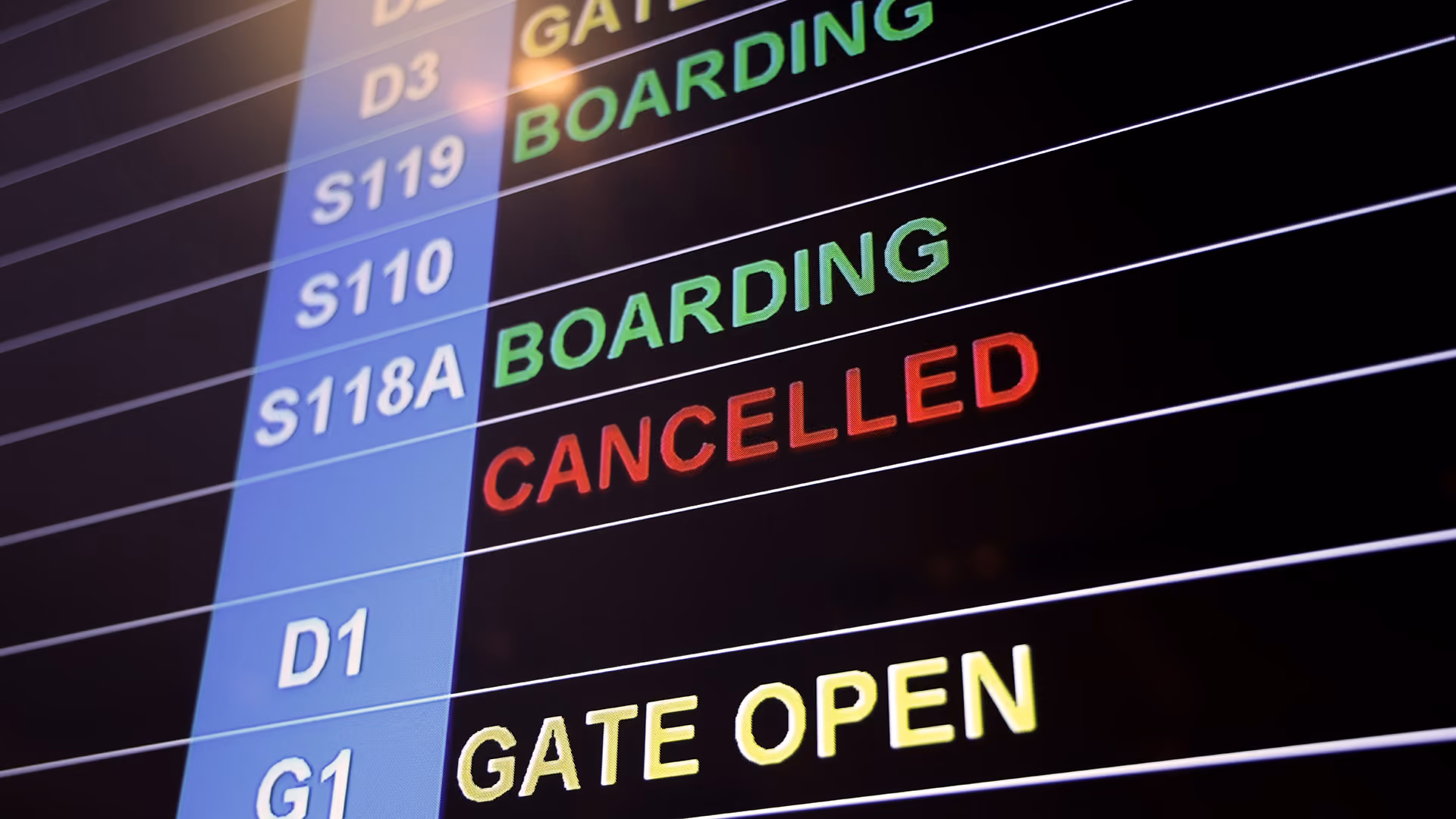 Flight departure board showing a cancelled flight