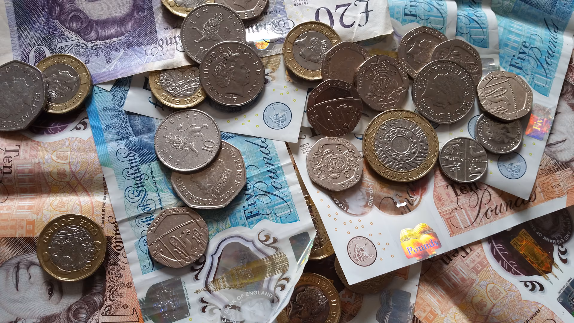 Pile of bank notes and coins, representing reserve requirements