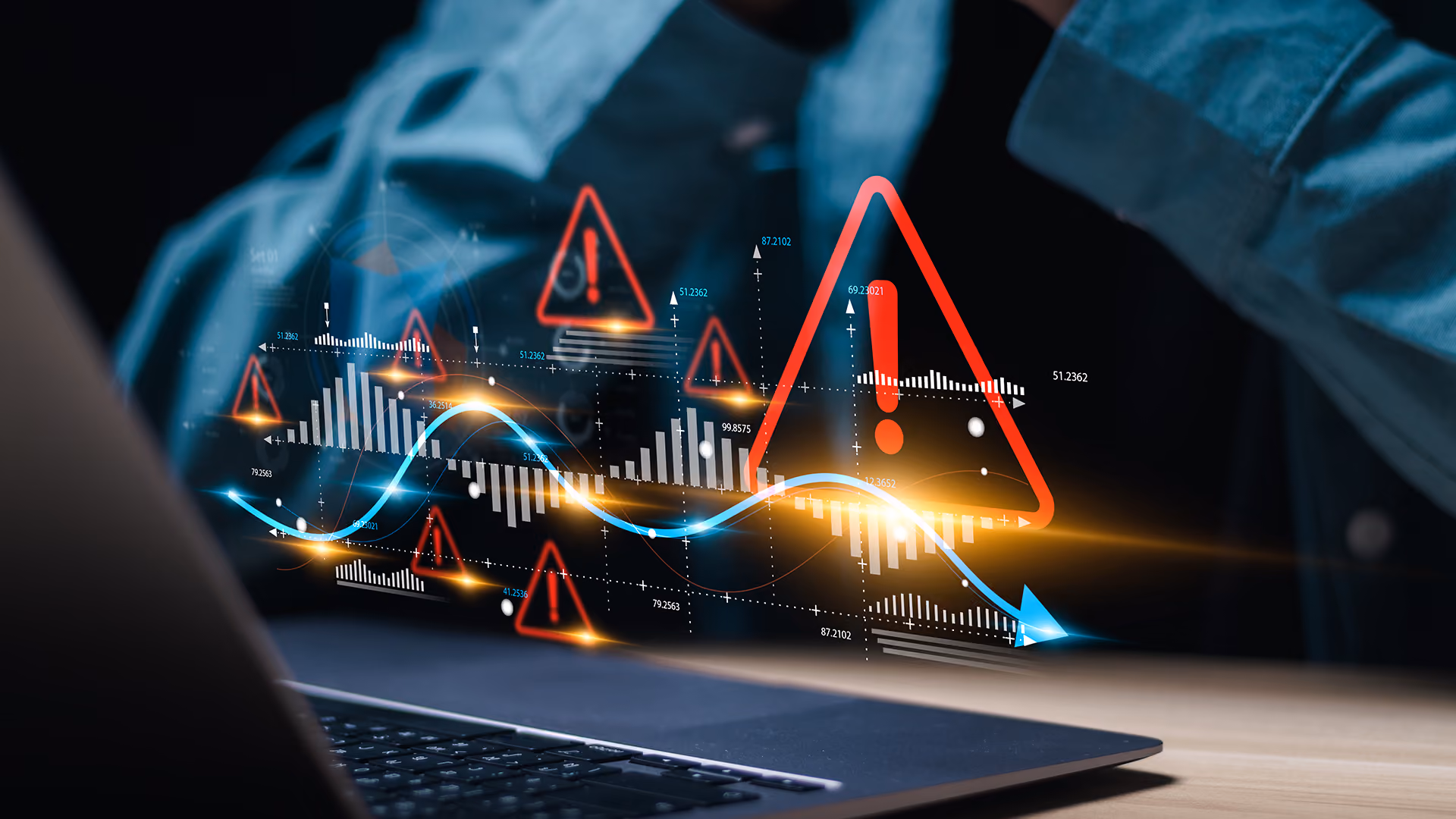 Man assessing financial risk on laptop