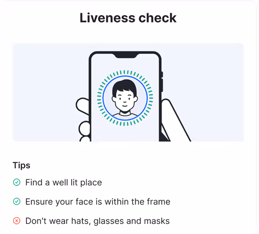 Illustration of a hand holding a smartphone with a face scan for a liveness check and tips to find a well-lit place, keep face within frame, and avoid hats, glasses, and masks.