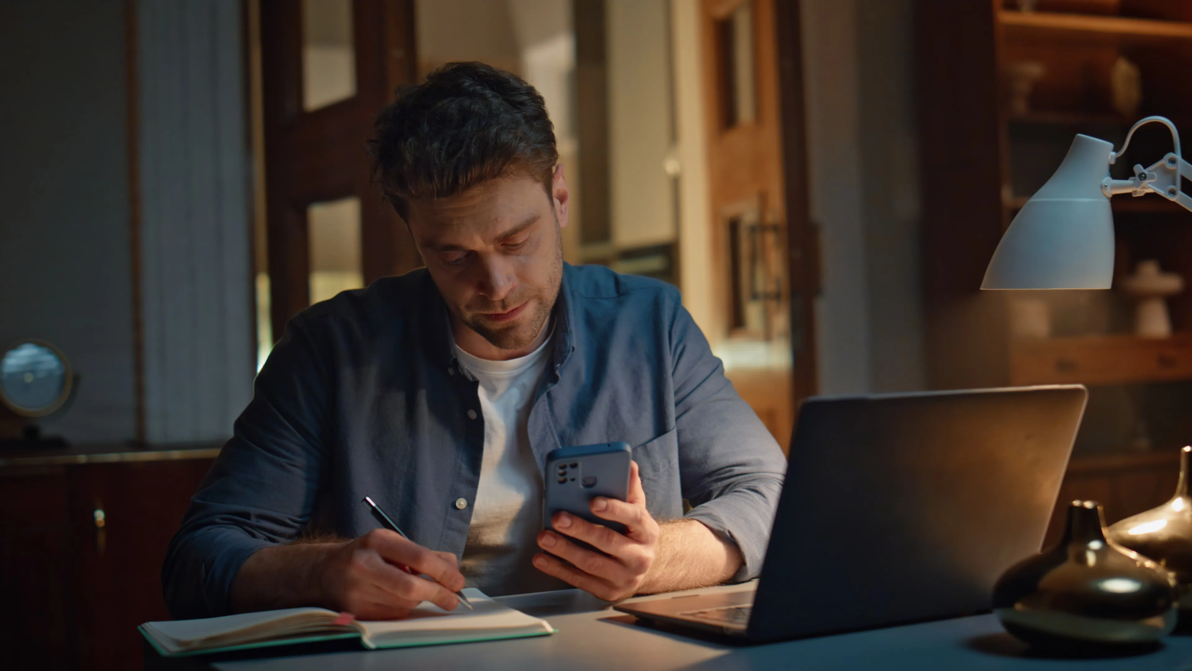 A man looking at his cell phone.