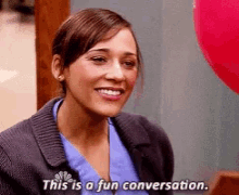 A gif of a lady having an awkward conversation and calling it "fun" sarcastically.