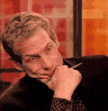 A gif of a man nodding in disagreement.