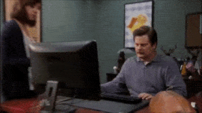 Ron Swanson throwing away a desktop.