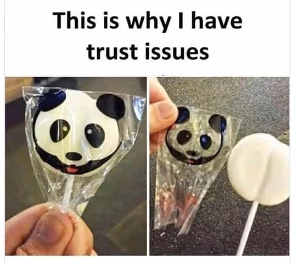 A meme displays two images of a panda lollipop, one in its wrapper showing the full panda face and the other unwrapped, revealing a plain white, heart-shaped candy. The text above reads, "This is why I have trust issues," highlighting the deceptive packaging.