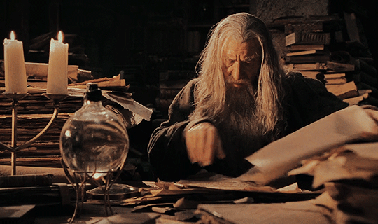Gandalf reading through scrolls 