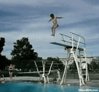 A man dives off a high dive