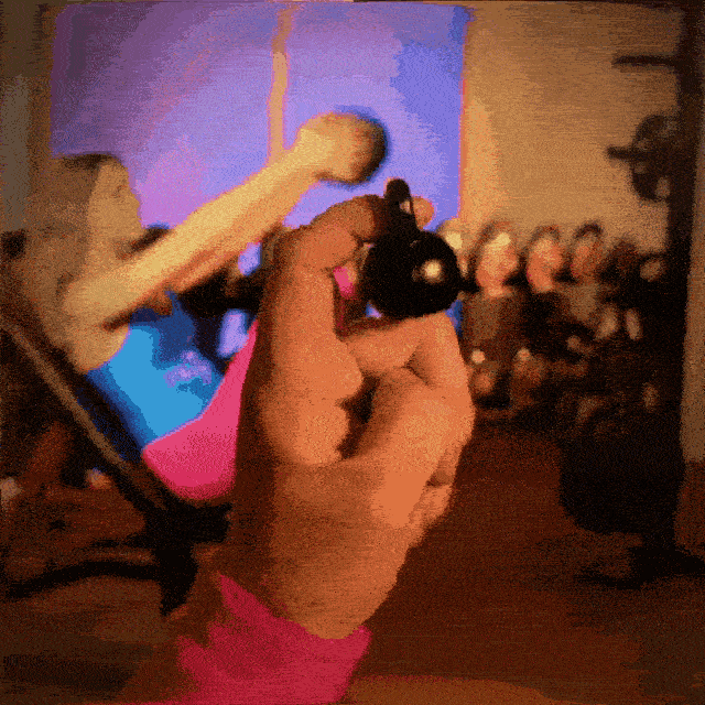A finger lifting a kettleball.