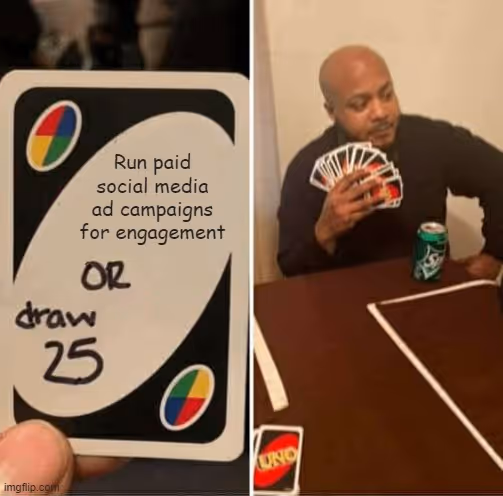 Man drawing UNO cards instead of doing paid social media ad campaigns