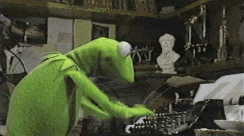 A GIF of Kermit the Frog frantically typing on a typewriter.