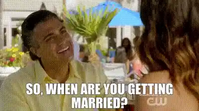 A gif of an annoying uncle asking about someone's wedding plans.