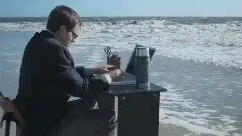 Man working on seashore