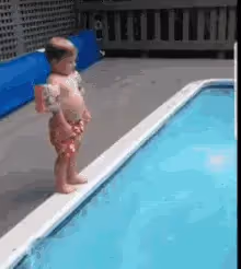 A baby diving into the pool