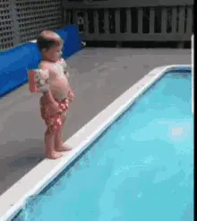 A baby diving into the pool
