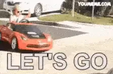 Gif of girl drifting saying lets go