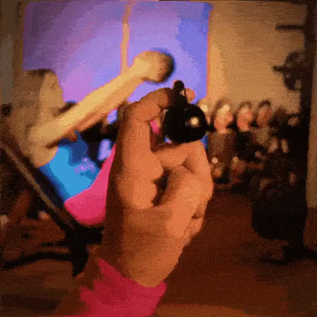 A finger lifting a kettleball.