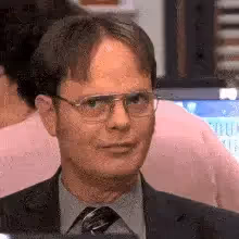 man pressing finger to his lips
