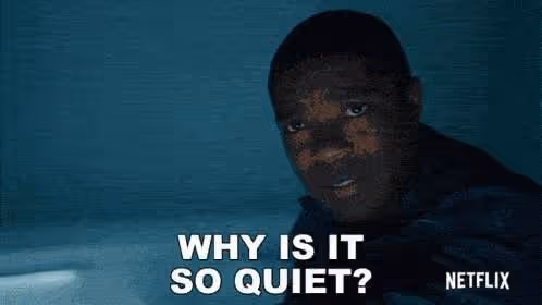 A young Black man looks up in confusion with the words "WHY IS IT SO QUIET?" superimposed on the image