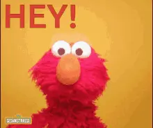 Elmo puppet with wide eyes saying