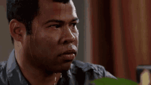 The image shows Jordan Peele sweating
