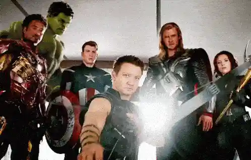 Hawkeye aiming an arrow with other Avengers.