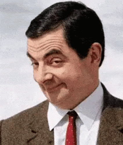 Mr. Bean raising eyebrows and smiling cunningly