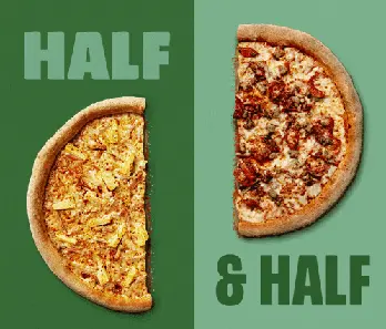 A pizza cut in half with two different toppings.