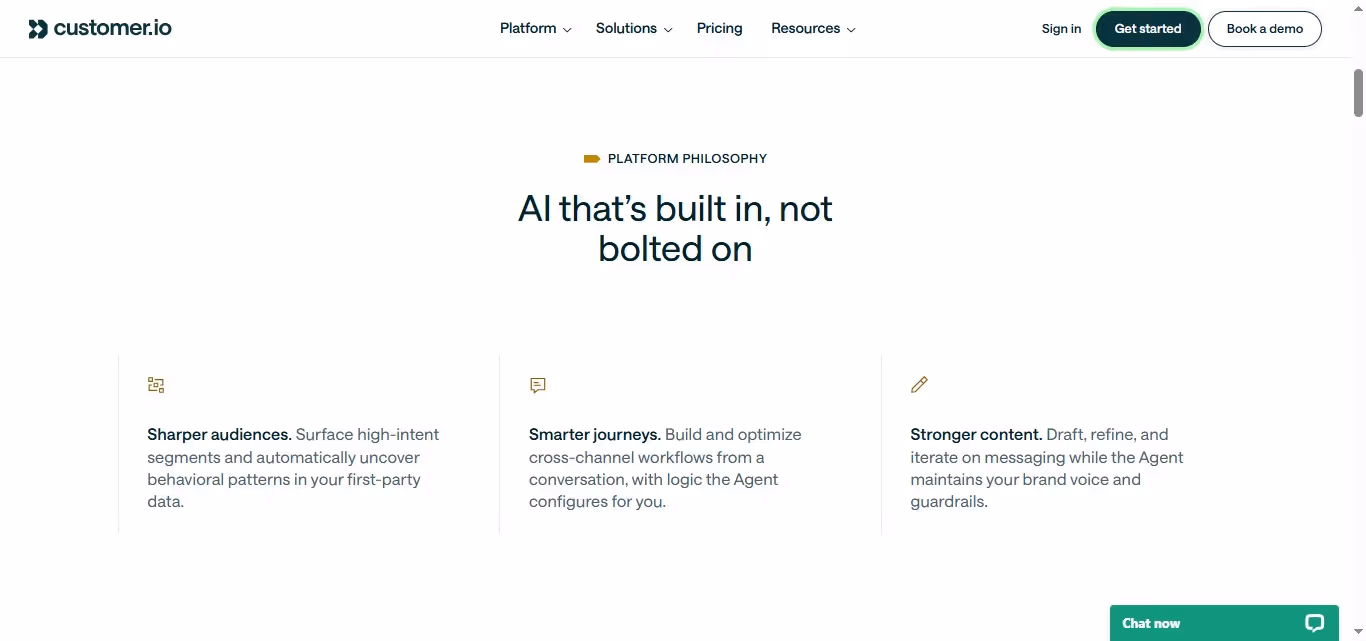Screenshot of Customer.io's platform philosophy section, highlighting "AI that's built in, not bolted on" with three sub-sections: Sharper audiences, Smarter journeys, and Stronger content.