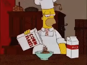 Homer Simpson pouring cornflakes into a bowl.