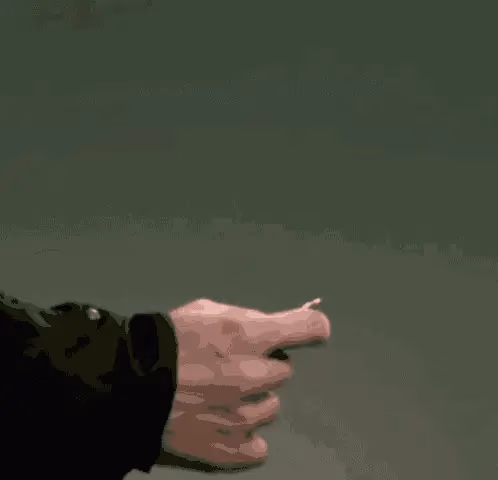 Close up of a person's hand in a pointing gesture, with a small creature on the tip of the index finger