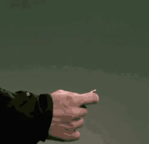 Close up of a person's hand in a pointing gesture, with a small creature on the tip of the index finger