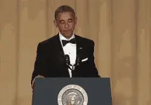 Barack Obama at a podium giving a speech.